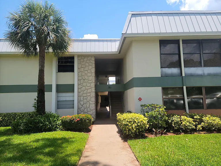 Spacious master suite with sitting area in Port Saint Lucie home