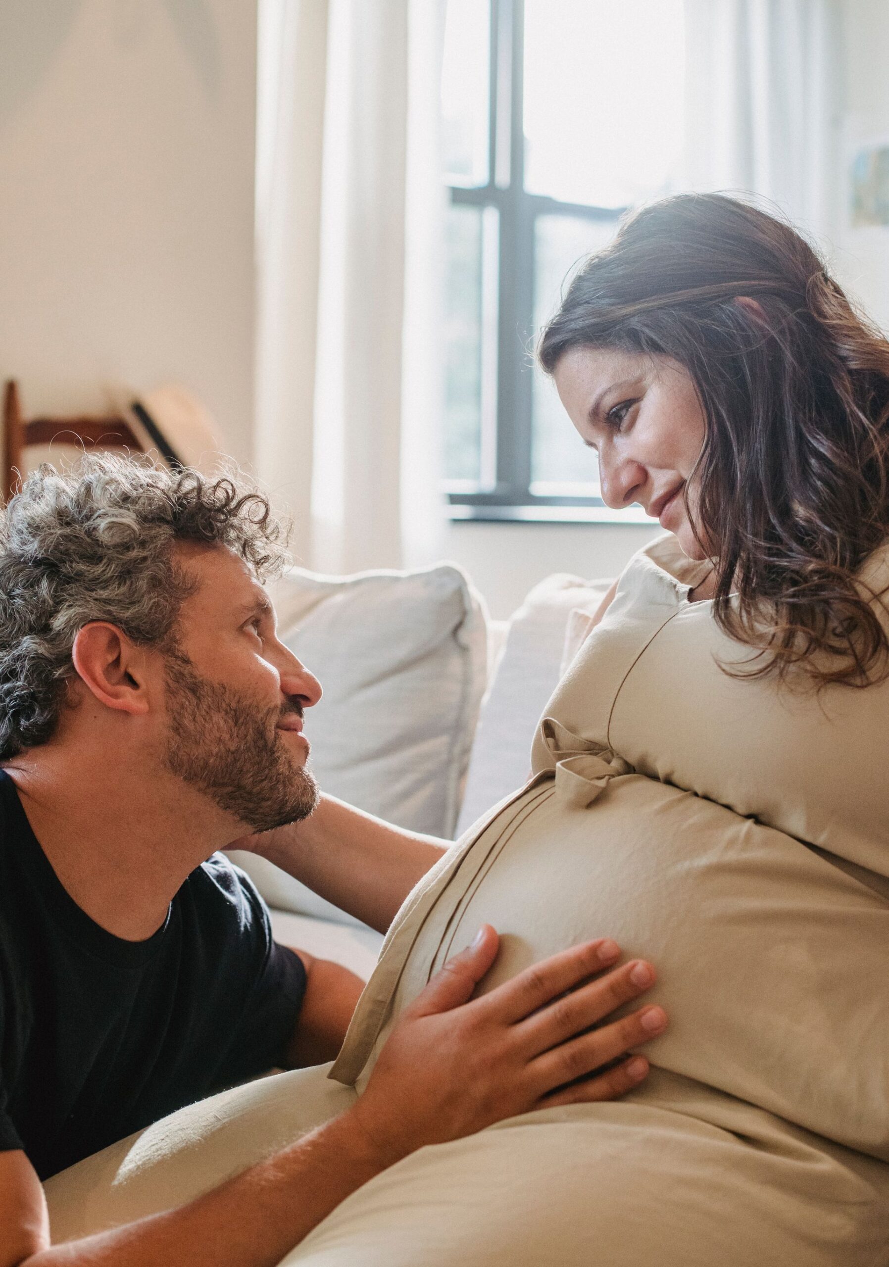 Couple at home on the sofa in their Port St. Lucie living room