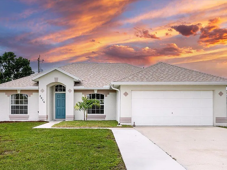 Master bedroom in Saint Lucie real estate with en-suite bathroom