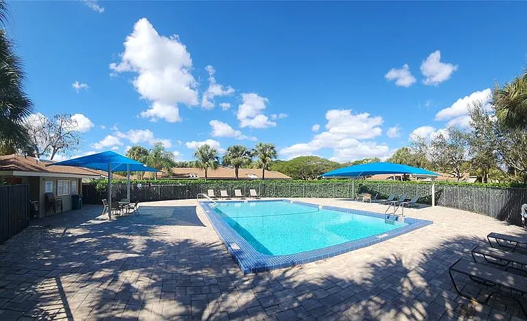 Walk-in shower with rainfall head in Port Saint Lucie home